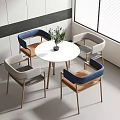 Modern Round Table With Four Chairs Blue Gray Backrest And Wooden Legs In Bright Room