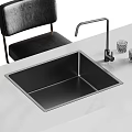 Modern Double Bowl Stainless Steel Sink with Tall Faucet and Glass Cups on Countertop