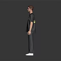 A man wearing black BARCELONA T-shirt gray pants and white shoes against gray background