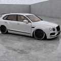 White Luxury Car With Brown Interior And Black Alloy Wheels In Spacious Concrete Room