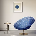 Sculptural Blue Leisure Chair With Intricate Hollowed Texture And Side Table In Modern Living Space