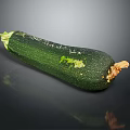 Fresh Ripe Green Zucchini Vegetable With Smooth Skin On Dark Background
