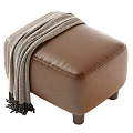 Cozy Brown Leather Stool Topped With Gray Blanket And Sturdy Wooden Legs