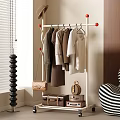 Modern Clothes Rack With Hanging Shirts Dresses Handbag And Decorative Suitcase In Room