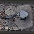 Damaged Concrete Slab With Bricks Gravel Metal Cover And Exposed Pipe