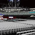Sports Stadium Featuring White Folding Chairs Stage And Lighting Equipment For Fitness Events