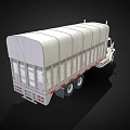 White Commercial Cargo Truck With Canvas Covered Bed And Dual Rear Wheels
