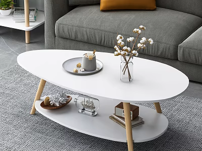White Oval Two Tier Coffee Table With Tray Cotton Bouquet Decorations And Books With Gray Sofa 3d model