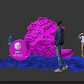 People Interacting With Pink Installation And IBC Amsterdam Logo On Blue Carpet