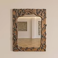 Ornate Carved Wooden Frame Mirror Reflecting Artworks And Wooden Flooring In Room Interior