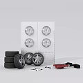 Stacked Car Tires With Wheel Rims On Wall And Repair Tools