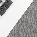 Modern Double Bed With Grey Headboard White Grey Bedding And Small Nightstands