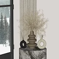 Golden Decorative Flowers in Woven Vase with Black White Vases on Marble Tabletop Snowy View