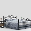 Double Bed With Black Iron Frame Ornate Design Blue Floral Bedding And Nightstand