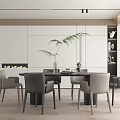Modern Restaurant Interior With Round Dining Table Gray Chairs Decorative Plant And Fireplace
