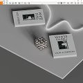 White Fang Books by Jack London Displayed on Gray Tabletop With Silver Flower Ornament