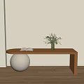 Wooden Shoe Bench With White Spherical Object Book And White Flowers On Wooden Floor