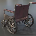 Medical Equipment Wheelchair Featuring Red Upholstered Seat And Metal Frame With Spoked Wheels
