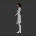 Woman in white long coat and long boots standing against gray background