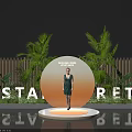 Floral Display Installation With Circular Platform Model Green Dress Palm Trees Bamboo Fence Backdrop