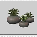 Three Gray Pots With Green Potted Plants On Black Surface And White Light Strip
