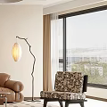 Patterned Accent Chair by Large Window with City View Curved Floor Lamp and Neutral Curtains