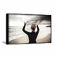 Back View Woman Portrait In Black Wetsuit Holding Surfboard On Beach With Ocean Waves