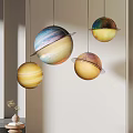 Colorful Planet Shaped Pendant Lights With Rings Hanging In Modern Interior