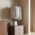 Modern Metal Frame Clothes Hanger with Hanging Clothes and Wooden Cabinet White Bag on Top