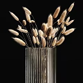 Transparent Vertical Striped Glass Vases Holding Fluffy Dried Flowers on Black Background