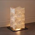 Three Stacked Cube Floor Lamps In Living Room Corner With Potted Plant And Natural Light