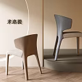 Modern Gray And Brown Dining Chairs With Curved Backrest And Sleek Legs