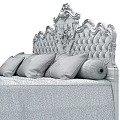 Luxurious Double Bed with Ornate Gold Carved Headboard and Brown Bedding Pillows