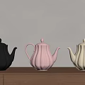 Black Pink and White Ceramic Teapots with Ribbed Design on Wooden Cabinet Light Wall