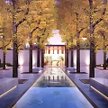 Serene Residential Landscape With Lush Yellow Trees Water Channel And Illuminated Pathway