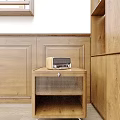Wooden Bedside Table With Radio On Top Against Paneled Wall Background