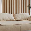 Elegant Living Room Interior Featuring Round Table Dried Flower Arrangement Black Vase And Beige Sofa