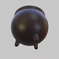 Brown Ceramic Pot With Green Liquid And Green Balls On Three Legs