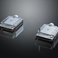 Two Silver Square Commercial Equipment Units With Grid Design Surface And Top Antenna