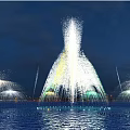 Colorful Night Fountain Display With Water Spray And Light Reflections On Water