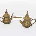 Traditional Brass Teapots With Intricate Decorative Patterns On White Background