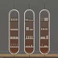Three Gold Arch Shelves With Bottles Boxes And Wine Glasses Decor