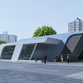 Modern Station Architecture With Curved Roof And Glass Facade Near Trees And High Rise Buildings