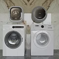 Two Modern White Front Load Washing Machines With Control Panels And Top Units