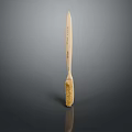 Wooden Brush With Yellow Bristles And Engraved Handle On Dark Background