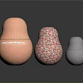 Decorative Matryoshka Style Objects With Orange Wavy Red White Speckled And Gray Dotted Textures