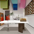 Clothing Store Interior Featuring Colorful Hanging Decor Wooden Wall Art and Display Table with Plants
