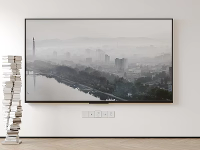 Wall Mounted Television Displaying City River View With Stacked Books Nearby 3d model