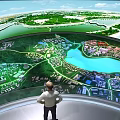 Modern Sales Office Featuring Circular Ceiling Lighting Strips Large Display Green Landscape Water Pool