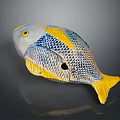 Vibrant Blue And Yellow Fish Sculpture With Detailed Scales And Smooth Surface